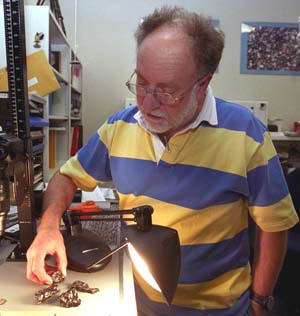 Randy Korotev, research associate professor of earth and planetary science, examines fragments of the Sikhote-Alin iron meteorite that fell in Siberia in 1947. The sample is the real McCoy, but Korotev regularly receives samples from meteorite enthusiasts that are wrong McKongs. Mistakenly identifed meteorites have the quaint moniker of meteorwrongs. Randy Korotev, research associate professor of earth and planetary science, examines fragments of the Sikhote-Alin iron meteorite that fell in Siberia in 1947. The sample is the real McCoy, but Korotev regularly receives samples from meteorite enthusiasts that are wrong McKongs. Mistakenly identifed meteorites have the quaint moniker of meteorwrongs.